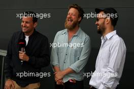 (L to R): Will Buxton (GBR) F1 Digital Presenter with Ted Dwane (GBR) and Ben Lovett (GBR) Mumford & Sons Musicians. 14.07.2019. Formula 1 World Championship, Rd 10, British Grand Prix, Silverstone, England, Race Day.