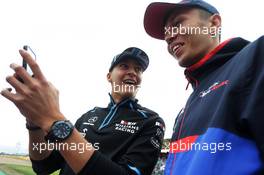 (L to R): George Russell (GBR) Williams Racing and Alexander Albon (THA) Scuderia Toro Rosso on the drivers parade. 14.07.2019. Formula 1 World Championship, Rd 10, British Grand Prix, Silverstone, England, Race Day.