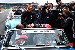 Lewis Hamilton (GBR) Mercedes AMG F1 with father Anthony Hamilton (GBR) and brother Nicolas Hamilton (GBR) on the drivers parade. 14.07.2019. Formula 1 World Championship, Rd 10, British Grand Prix, Silverstone, England, Race Day.