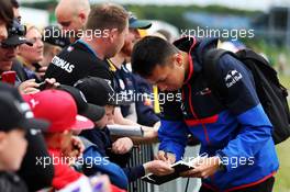 Alexander Albon (THA) Scuderia Toro Rosso signs autographs for the fans. 14.07.2019. Formula 1 World Championship, Rd 10, British Grand Prix, Silverstone, England, Race Day.