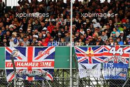 Lewis Hamilton (GBR) Mercedes AMG F1 banners with fans in the grandstand. 14.07.2019. Formula 1 World Championship, Rd 10, British Grand Prix, Silverstone, England, Race Day.