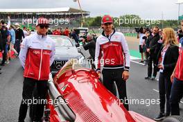 (L to R): Kimi Raikkonen (FIN) Alfa Romeo Racing and Antonio Giovinazzi (ITA) Alfa Romeo Racing on the drivers parade. 14.07.2019. Formula 1 World Championship, Rd 10, British Grand Prix, Silverstone, England, Race Day.