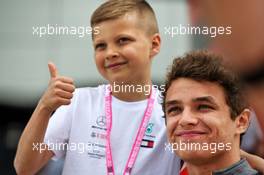 Lando Norris (GBR) McLaren with a young fan. 11.07.2019. Formula 1 World Championship, Rd 10, British Grand Prix, Silverstone, England, Preparation Day.