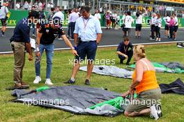 (L to R): Karun Chandhok (IND) Sky Sports F1 Pitlane Reporter; Pierre Gasly (FRA) Red Bull Racing; Ted Kravitz (GBR) Sky Sports Pitlane Reporter - tent erection. 11.07.2019. Formula 1 World Championship, Rd 10, British Grand Prix, Silverstone, England, Preparation Day.