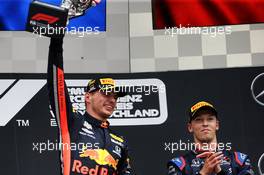 Race winner Max Verstappen (NLD) Red Bull Racing celebrates on the podium with Daniil Kvyat (RUS) Scuderia Toro Rosso. 28.07.2019. Formula 1 World Championship, Rd 11, German Grand Prix, Hockenheim, Germany, Race Day.
