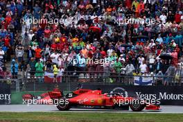 Sebastian Vettel (GER) Ferrari SF90 passes team mate Charles Leclerc (MON) Ferrari SF90 who crashed out of the race. 28.07.2019. Formula 1 World Championship, Rd 11, German Grand Prix, Hockenheim, Germany, Race Day.