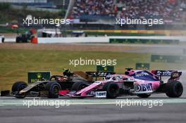 (L to R): Kevin Magnussen (DEN) Haas VF-19 and Sergio Perez (MEX) Racing Point F1 Team RP19 battle for position. 28.07.2019. Formula 1 World Championship, Rd 11, German Grand Prix, Hockenheim, Germany, Race Day.