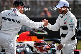 Lewis Hamilton (GBR) Mercedes AMG F1 celebrates his pole position in qualifying parc ferme with third placed team mate Valtteri Bottas (FIN) Mercedes AMG F1. 27.07.2019. Formula 1 World Championship, Rd 11, German Grand Prix, Hockenheim, Germany, Qualifying Day.