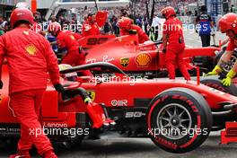 Sebastian Vettel (GER) Ferrari SF90 and Charles Leclerc (MON) Ferrari SF90 in the pits.