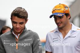 (L to R): Lando Norris (GBR) McLaren with team mate Carlos Sainz Jr (ESP) McLaren. 02.08.2019. Formula 1 World Championship, Rd 12, Hungarian Grand Prix, Budapest, Hungary, Practice Day.