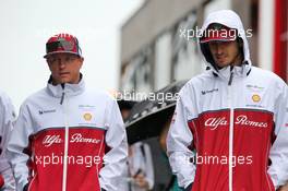 (L to R): Kimi Raikkonen (FIN) Alfa Romeo Racing with Antonio Giovinazzi (ITA) Alfa Romeo Racing. 02.08.2019. Formula 1 World Championship, Rd 12, Hungarian Grand Prix, Budapest, Hungary, Practice Day.