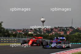 Daniil Kvyat (RUS) Scuderia Toro Rosso STR14 and Sebastian Vettel (GER) Ferrari SF90. 02.08.2019. Formula 1 World Championship, Rd 12, Hungarian Grand Prix, Budapest, Hungary, Practice Day.