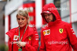 (L to R): Britta Roeske (AUT) Ferrari Press Officer with Sebastian Vettel (GER) Ferrari. 02.08.2019. Formula 1 World Championship, Rd 12, Hungarian Grand Prix, Budapest, Hungary, Practice Day.