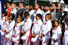 Grid kids with the drivers as the grid observes the national anthem. 04.08.2019. Formula 1 World Championship, Rd 12, Hungarian Grand Prix, Budapest, Hungary, Race Day.