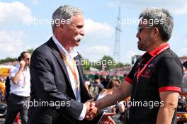 (L to R): Chase Carey (USA) Formula One Group Chairman with Toyoharu Tanabe (JPN) Honda Racing F1 Technical Director on the grid. 04.08.2019. Formula 1 World Championship, Rd 12, Hungarian Grand Prix, Budapest, Hungary, Race Day.
