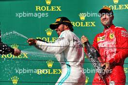 Race winner Lewis Hamilton (GBR) Mercedes AMG F1 celebrates on the podium with Sebastian Vettel (GER) Ferrari. 04.08.2019. Formula 1 World Championship, Rd 12, Hungarian Grand Prix, Budapest, Hungary, Race Day.