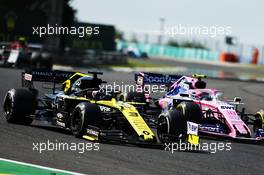 Daniel Ricciardo (AUS) Renault F1 Team RS19 and Lance Stroll (CDN) Racing Point F1 Team RP19 battle for position. 04.08.2019. Formula 1 World Championship, Rd 12, Hungarian Grand Prix, Budapest, Hungary, Race Day.