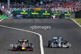 Max Verstappen (NLD) Red Bull Racing RB15 and Lewis Hamilton (GBR) Mercedes AMG F1 W10 battle for the lead of the race. 04.08.2019. Formula 1 World Championship, Rd 12, Hungarian Grand Prix, Budapest, Hungary, Race Day.