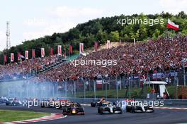 (L to R): Max Verstappen (NLD) Red Bull Racing RB15; Valtteri Bottas (FIN) Mercedes AMG F1 W10; and Lewis Hamilton (GBR) Mercedes AMG F1 W10, at the start of the race. 04.08.2019. Formula 1 World Championship, Rd 12, Hungarian Grand Prix, Budapest, Hungary, Race Day.