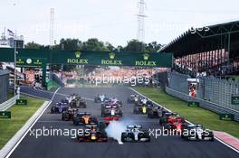 (L to R): Max Verstappen (NLD) Red Bull Racing RB15; Valtteri Bottas (FIN) Mercedes AMG F1 W10; and Lewis Hamilton (GBR) Mercedes AMG F1 W10, at the start of the race. 04.08.2019. Formula 1 World Championship, Rd 12, Hungarian Grand Prix, Budapest, Hungary, Race Day.