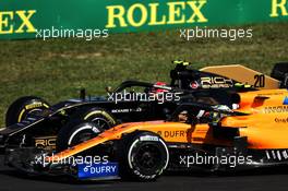 Kevin Magnussen (DEN) Haas VF-19 and Lando Norris (GBR) McLaren MCL34 battle for position. 04.08.2019. Formula 1 World Championship, Rd 12, Hungarian Grand Prix, Budapest, Hungary, Race Day.