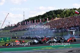 (L to R): Max Verstappen (NLD) Red Bull Racing RB15; Valtteri Bottas (FIN) Mercedes AMG F1 W10; and Lewis Hamilton (GBR) Mercedes AMG F1 W10, at the start of the race. 04.08.2019. Formula 1 World Championship, Rd 12, Hungarian Grand Prix, Budapest, Hungary, Race Day.