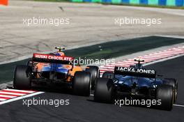Lando Norris (GBR) McLaren MCL34 and Kevin Magnussen (DEN) Haas VF-19 battle for position. 04.08.2019. Formula 1 World Championship, Rd 12, Hungarian Grand Prix, Budapest, Hungary, Race Day.