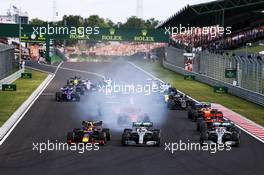 (L to R): Max Verstappen (NLD) Red Bull Racing RB15, Valtteri Bottas (FIN) Mercedes AMG F1 W10, and Lewis Hamilton (GBR) Mercedes AMG F1 W10, at the start of the race. 04.08.2019. Formula 1 World Championship, Rd 12, Hungarian Grand Prix, Budapest, Hungary, Race Day.