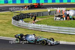 Lewis Hamilton (GBR) Mercedes AMG F1 W10 leads Max Verstappen (NLD) Red Bull Racing RB15. 04.08.2019. Formula 1 World Championship, Rd 12, Hungarian Grand Prix, Budapest, Hungary, Race Day.