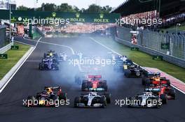 (L to R): Max Verstappen (NLD) Red Bull Racing RB15; Valtteri Bottas (FIN) Mercedes AMG F1 W10; and Lewis Hamilton (GBR) Mercedes AMG F1 W10, at the start of the race. 04.08.2019. Formula 1 World Championship, Rd 12, Hungarian Grand Prix, Budapest, Hungary, Race Day.