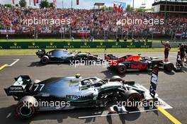 Max Verstappen (NLD) Red Bull Racing RB15 celebrates his pole position in qualifying parc ferme with Valtteri Bottas (FIN) Mercedes AMG F1 W10 and Lewis Hamilton (GBR) Mercedes AMG F1 W10. 03.08.2019. Formula 1 World Championship, Rd 12, Hungarian Grand Prix, Budapest, Hungary, Qualifying Day.