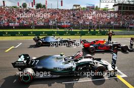 Max Verstappen (NLD) Red Bull Racing RB15 celebrates his pole position in qualifying parc ferme with Valtteri Bottas (FIN) Mercedes AMG F1 W10 and Lewis Hamilton (GBR) Mercedes AMG F1 W10. 03.08.2019. Formula 1 World Championship, Rd 12, Hungarian Grand Prix, Budapest, Hungary, Qualifying Day.
