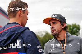 (L to R): Daniil Kvyat (RUS) Scuderia Toro Rosso with Fernando Alonso (ESP) McLaren. 06.09.2019. Formula 1 World Championship, Rd 14, Italian Grand Prix, Monza, Italy, Practice Day.