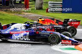 Pierre Gasly (FRA) Scuderia Toro Rosso STR14 spins in the first practice session and is passed by by Alexander Albon (THA) Red Bull Racing RB15. 06.09.2019. Formula 1 World Championship, Rd 14, Italian Grand Prix, Monza, Italy, Practice Day.