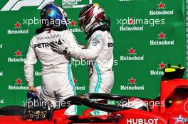 (L to R): Valtteri Bottas (FIN) Mercedes AMG F1 celebrates second position with third placed team mate Lewis Hamilton (GBR) Mercedes AMG F1 in parc ferme. 08.09.2019. Formula 1 World Championship, Rd 14, Italian Grand Prix, Monza, Italy, Race Day.