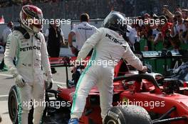 Lewis Hamilton (GBR) Mercedes AMG F1 W10 and Valtteri Bottas (FIN) Mercedes AMG F1 W10 congratulate Charles Leclerc (MON) Ferrari SF90. 08.09.2019. Formula 1 World Championship, Rd 14, Italian Grand Prix, Monza, Italy, Race Day.
