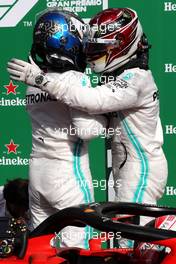(L to R): Valtteri Bottas (FIN) Mercedes AMG F1 celebrates second position with third placed team mate Lewis Hamilton (GBR) Mercedes AMG F1 in parc ferme. 08.09.2019. Formula 1 World Championship, Rd 14, Italian Grand Prix, Monza, Italy, Race Day.