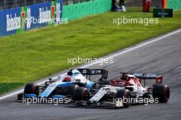 Robert Kubica (POL) Williams Racing FW42 and Kimi Raikkonen (FIN) Alfa Romeo Racing C38 battle for position. 08.09.2019. Formula 1 World Championship, Rd 14, Italian Grand Prix, Monza, Italy, Race Day.