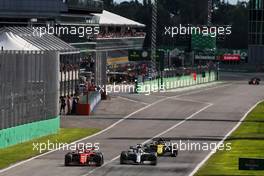 Charles Leclerc (MON) Ferrari SF90 and Lewis Hamilton (GBR) Mercedes AMG F1 W10 battle for position. 08.09.2019. Formula 1 World Championship, Rd 14, Italian Grand Prix, Monza, Italy, Race Day.