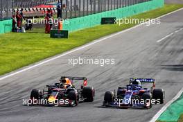 Max Verstappen (NLD) Red Bull Racing RB15 and Pierre Gasly (FRA) Scuderia Toro Rosso STR14 battle for position. 08.09.2019. Formula 1 World Championship, Rd 14, Italian Grand Prix, Monza, Italy, Race Day.