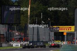 (L to R): Nico Hulkenberg (GER) Renault F1 Team RS19; Lewis Hamilton (GBR) Mercedes AMG F1 W10; and Charles Leclerc (MON) Ferrari SF90 battle for position. 08.09.2019. Formula 1 World Championship, Rd 14, Italian Grand Prix, Monza, Italy, Race Day.