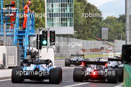 Robert Kubica (POL) Williams Racing FW42 and Lewis Hamilton (GBR) Mercedes AMG F1 W10 at the pit lane exit. 07.09.2019. Formula 1 World Championship, Rd 14, Italian Grand Prix, Monza, Italy, Qualifying Day.