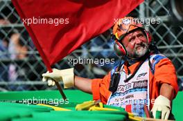 A marshal waves the red flag during qualifying. 07.09.2019. Formula 1 World Championship, Rd 14, Italian Grand Prix, Monza, Italy, Qualifying Day.