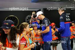Pierre Gasly (FRA) Scuderia Toro Rosso and Daniil Kvyat (RUS) Scuderia Toro Rosso with grid kids on the drivers parade. 08.09.2019. Formula 1 World Championship, Rd 14, Italian Grand Prix, Monza, Italy, Race Day.
