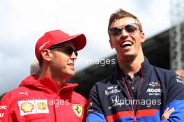 (L to R): Sebastian Vettel (GER) Ferrari and Daniil Kvyat (RUS) Scuderia Toro Rosso on the drivers parade. 08.09.2019. Formula 1 World Championship, Rd 14, Italian Grand Prix, Monza, Italy, Race Day.