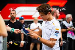 Lando Norris (GBR) McLaren signs autographs for the fans. 05.09.2019. Formula 1 World Championship, Rd 14, Italian Grand Prix, Monza, Italy, Preparation Day.