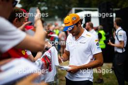 Carlos Sainz Jr (ESP) McLaren signs autographs for the fans. 05.09.2019. Formula 1 World Championship, Rd 14, Italian Grand Prix, Monza, Italy, Preparation Day.