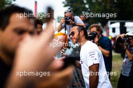 Lewis Hamilton (GBR) Mercedes AMG F1 signs autographs for the fans. 05.09.2019. Formula 1 World Championship, Rd 14, Italian Grand Prix, Monza, Italy, Preparation Day.