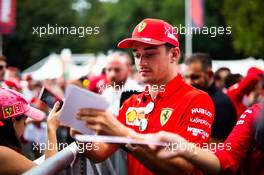 Charles Leclerc (MON) Ferrari signs autographs for the fans. 05.09.2019. Formula 1 World Championship, Rd 14, Italian Grand Prix, Monza, Italy, Preparation Day.