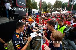 Alexander Albon (THA) Red Bull Racing and Max Verstappen (NLD) Red Bull Racing sign autographs for the fans. 05.09.2019. Formula 1 World Championship, Rd 14, Italian Grand Prix, Monza, Italy, Preparation Day.